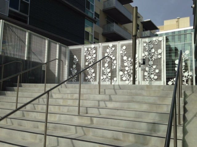 Strong ornamental iron fence with a commercial entry gate in Sacramento, designed for lasting security and professional appeal.