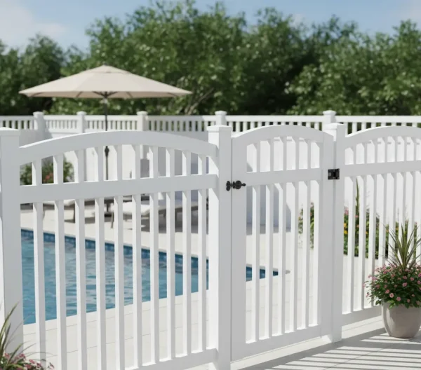 White vinyl pool fence with smooth panels and lattice top enclosing a backyard swimming pool with lounge chairs.