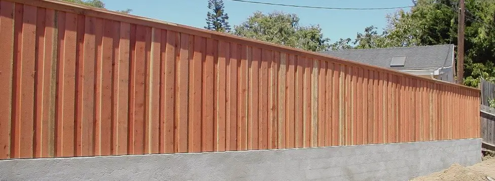 Citrus Heights Board on Board Fence Installation A custom board on board fence in Citrus Heights, featuring thick overlapping redwood planks, precise alignment, and a finished design that blocks visibility and enhances backyard privacy.