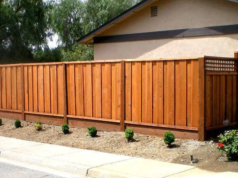 North Highlands Board on Board Fence Installation A North Highlands board on board fence built with overlapping redwood planks, creating full privacy, rich wood tone, and a durable structure for long lasting backyard protection.